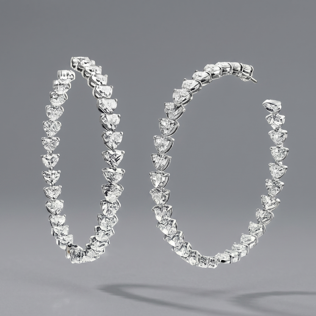 Glimmering Heart Duet Earrings, heart-shaped diamond hoops in lab-grown diamonds, 9/14/18kt gold, at Inarra Atelier Kolkata.