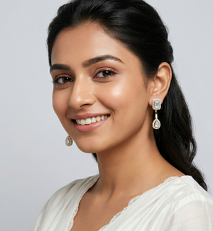 IGI-certified lab-grown emerald and pear-cut diamond solitaire earrings